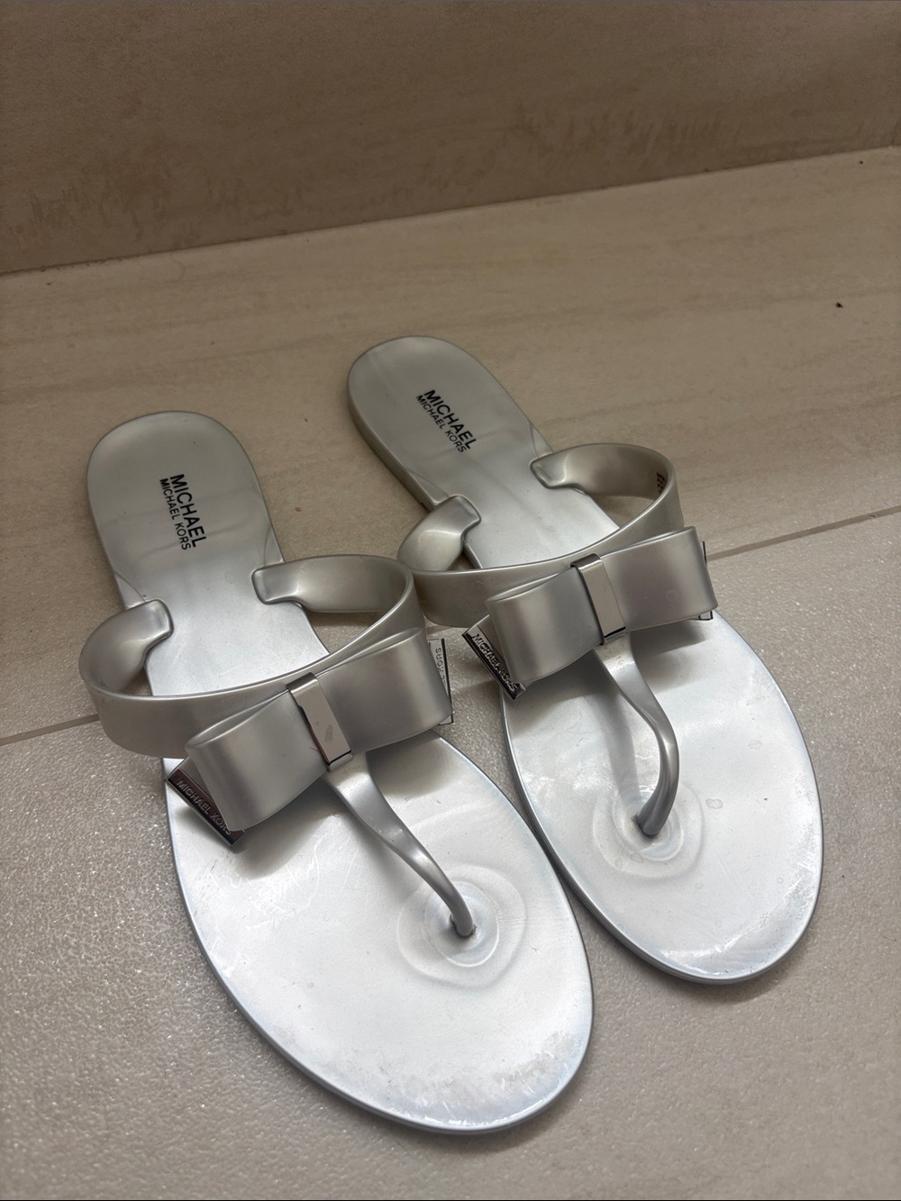 Michael Kors Metallic Silver Bow Thong Sandals - Women's